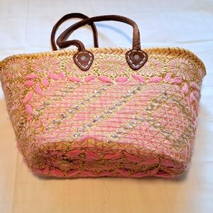 Straw bag with embellishments